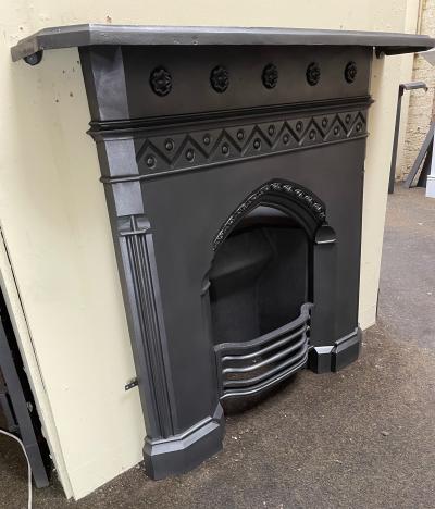 Antique Gothic cast iron fireplace - side