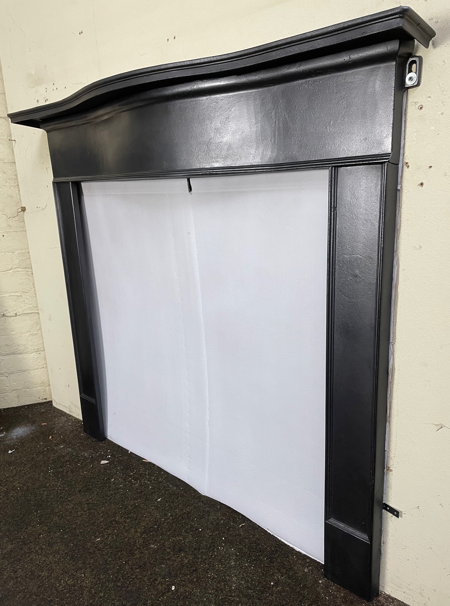 Antique 1930’s cast iron fireplace - side