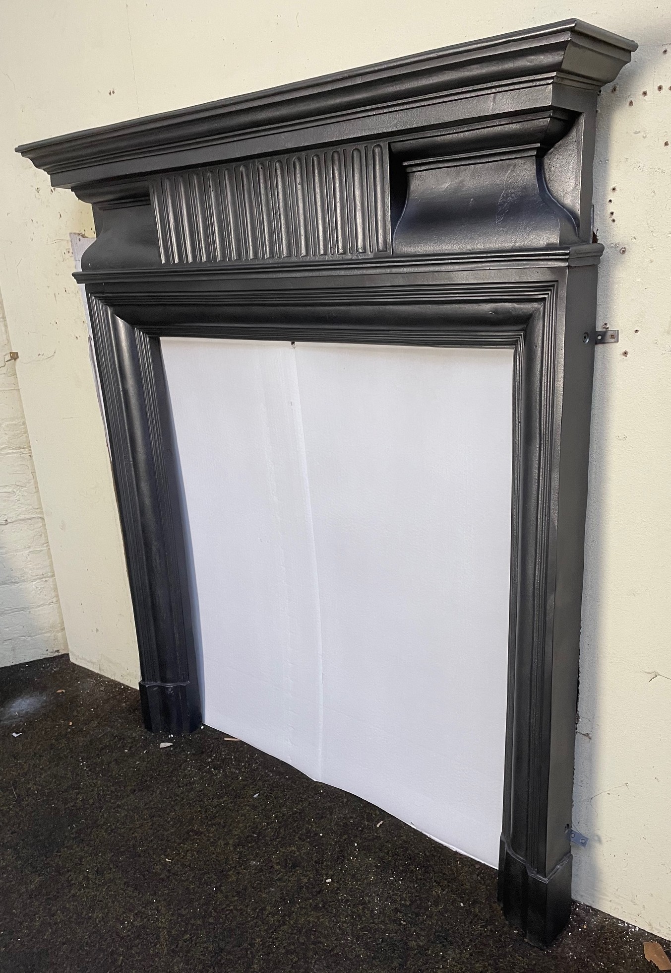 Antique Edwardian cast iron stove surround - side