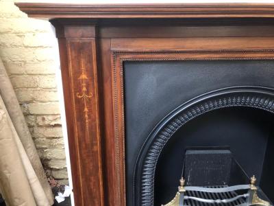 Antique Edwardian mahogany fire surround - close