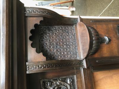 Antique mahogany tudor style fire surround - corner