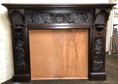 Antique mahogany tudor style fire surround