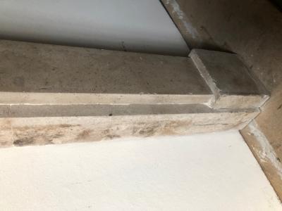 Antique rustic sandstone fire surround - close